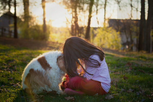 Girl hugging dog